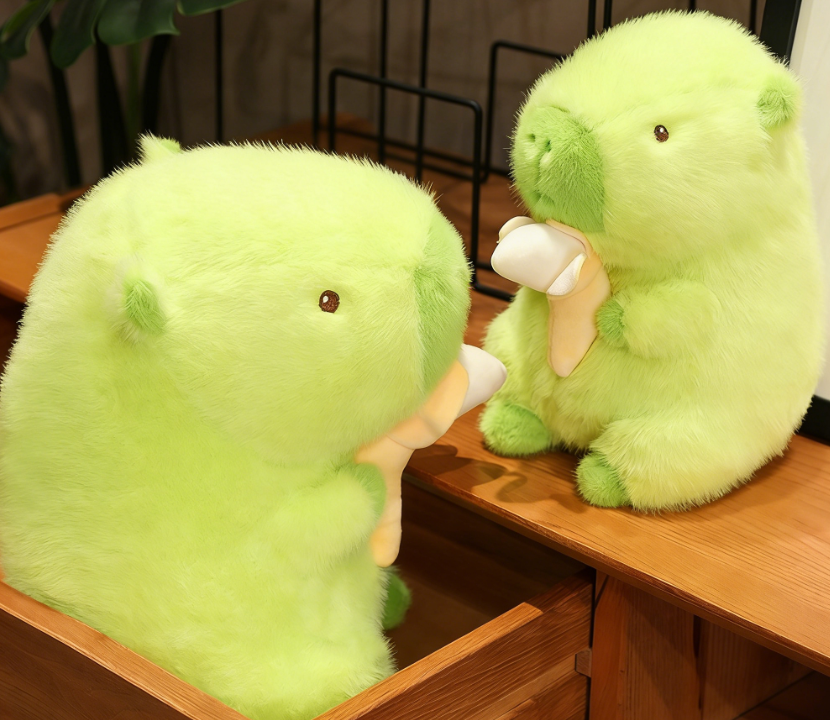 Green capybara eating a banana