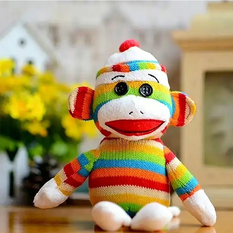 Custom rainbow striped sock monkey plush toys based on customer designs